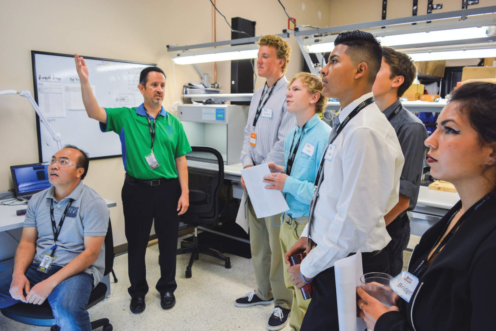 JA volunteers working with students on finance